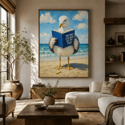 Funny seagull reading canvas print styled in a bright coastal living room above a walnut sideboard