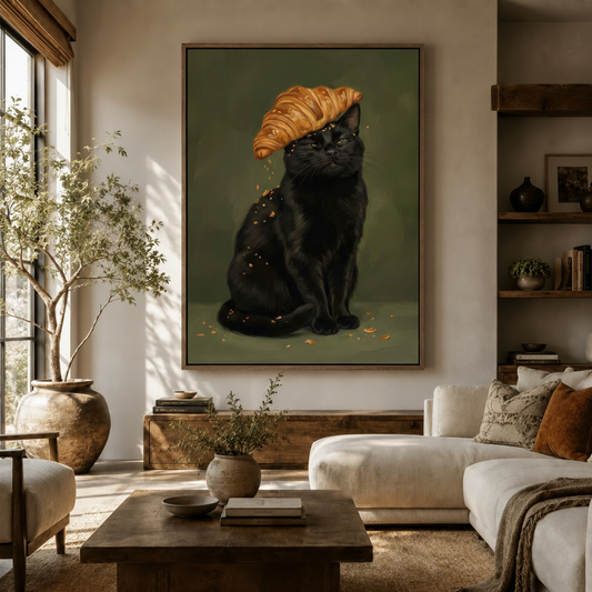 Funny black cat croissant hat canvas wall art displayed in a warm neutral living room