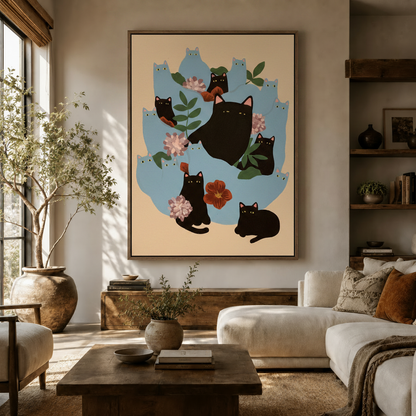 Whimsical black cats and pink floral canvas art displayed in a cozy living room above a wooden sideboard