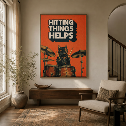 Hitting Things Helps cat drummer framed print hanging in a neutral entryway hallway