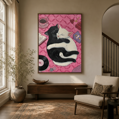 Framed whimsical cat painting with pink background displayed in a bright entryway hallway