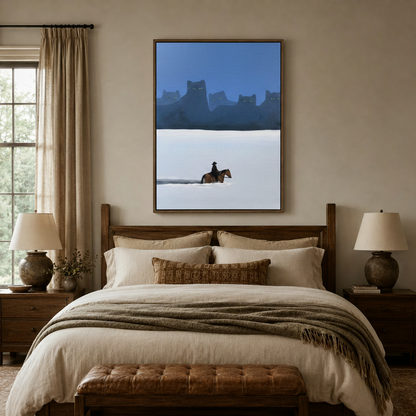 Surreal western landscape canvas in walnut floater frame above a linen bed in a warm neutral bedroom