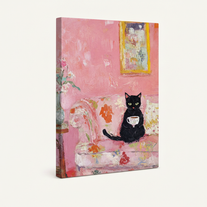 Gallery wrap canvas of black cat holding teacup on pink floral sofa, three-quarter side view