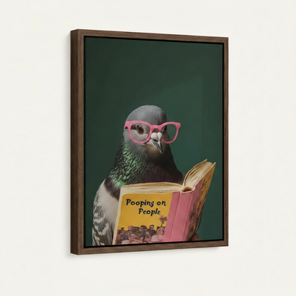 Framed canvas close-up of pigeon wearing pink glasses reading Pooping on People book – funny bird wall art