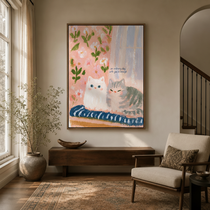 Framed whimsical cat wall art in entryway with arched doorway and warm lighting