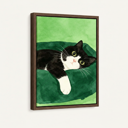 Framed tuxedo cat watercolor canvas with dark walnut frame mounted on off-white wall